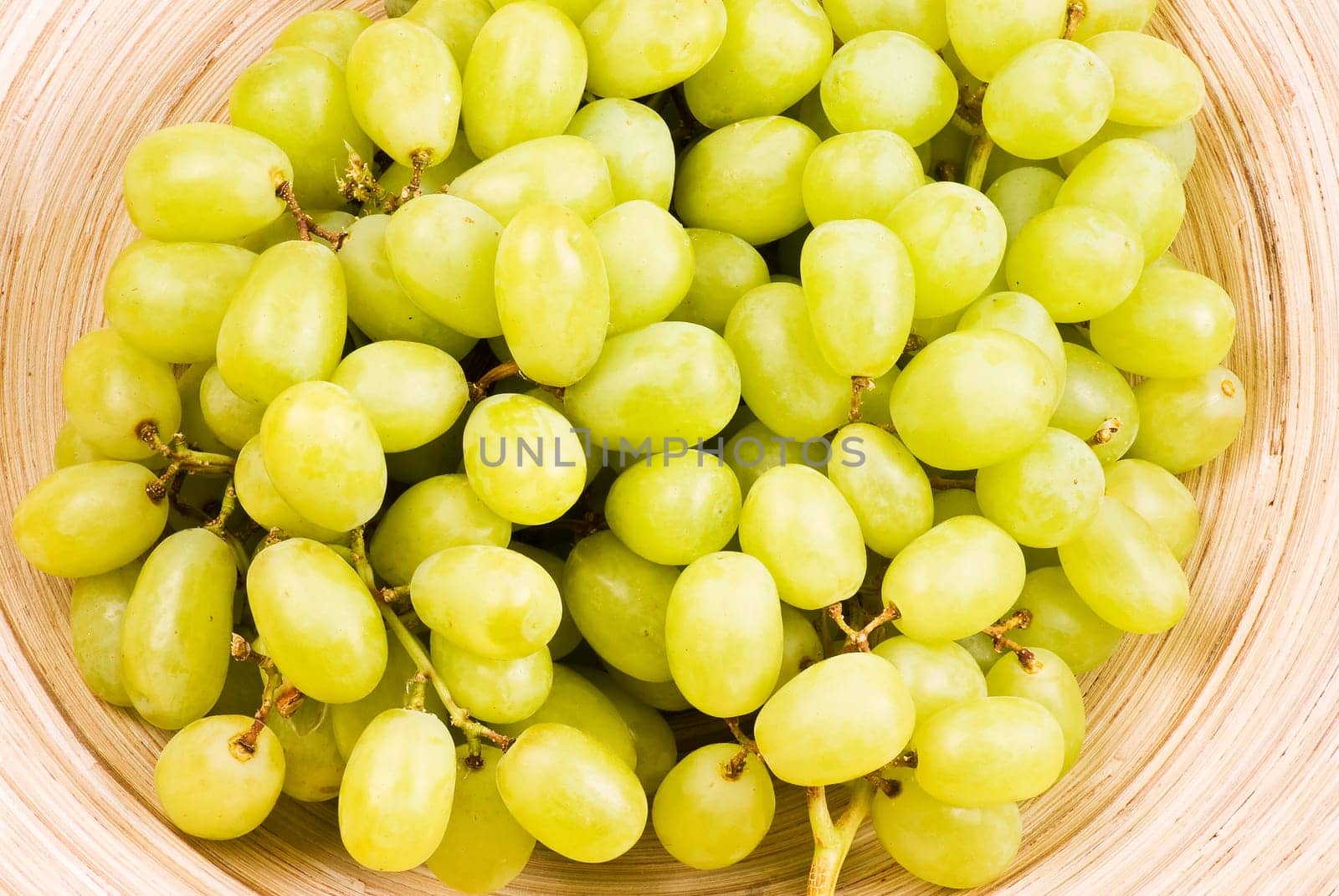Grape fruits in wooden bowl