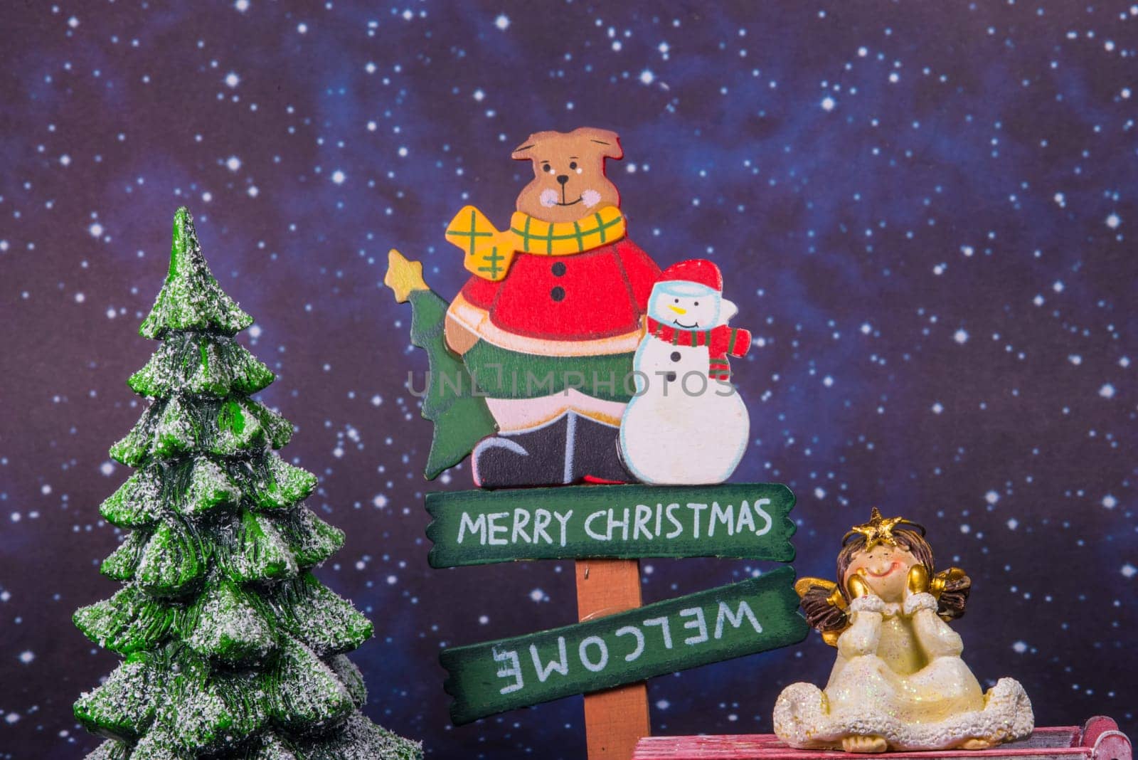 merry christmas board with angel and christmas tree