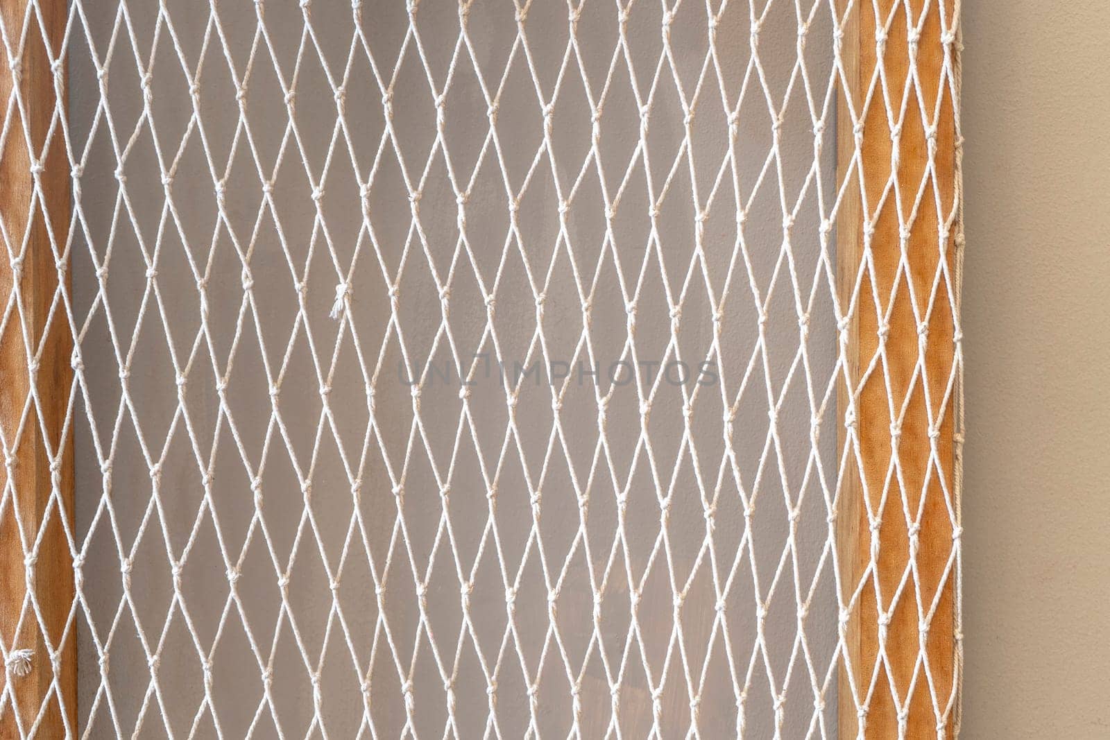 White mesh and wood and concrete wall background