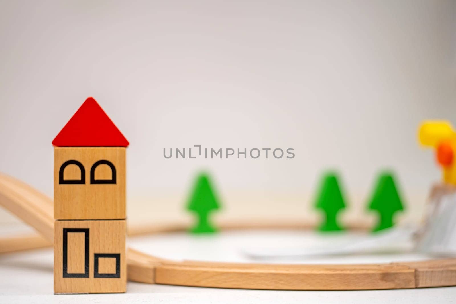 Model houses and trees on cream background