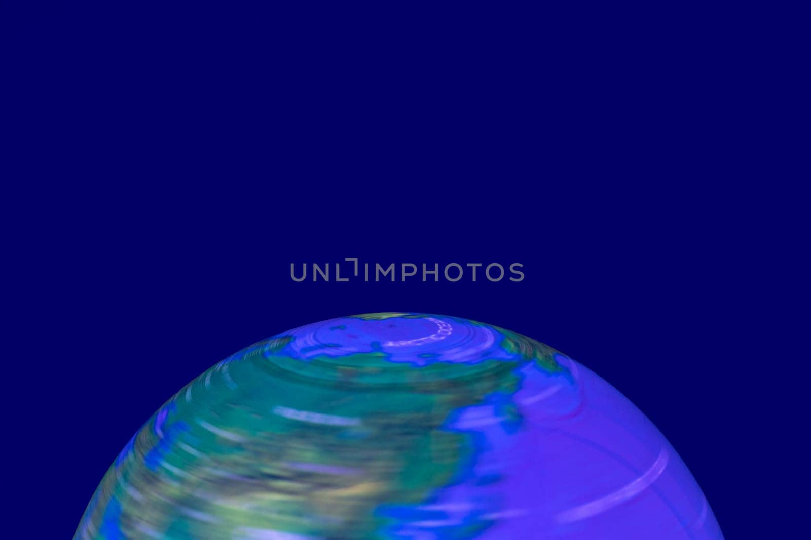 Background Earth shining. A luminous and rotating terrestrial globe or planet earth against dark background with space for design. Beautiful backdrop. Macro.