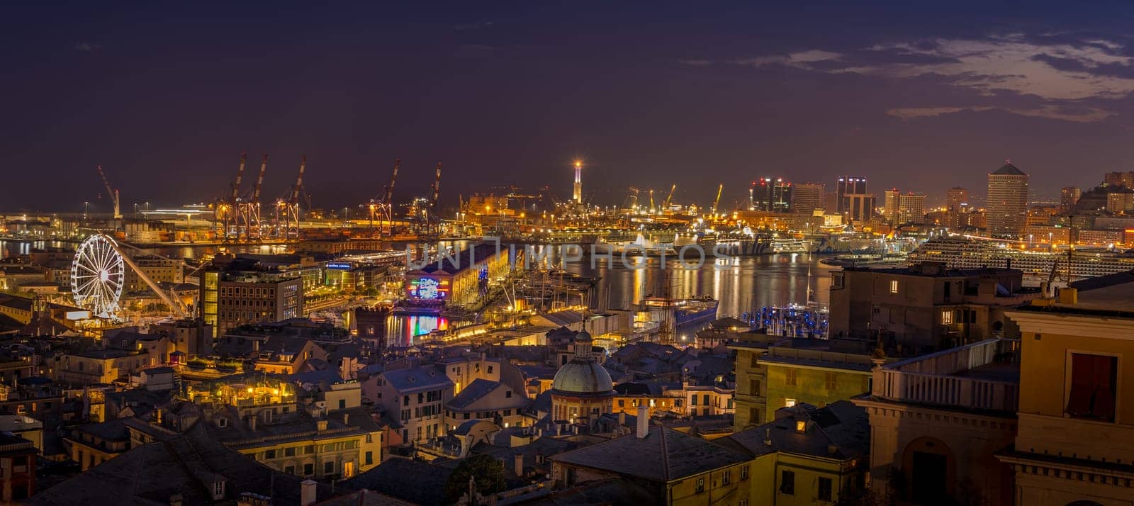 Genoa, Italy - 09 19 2020: Genoa harbor from Spianata Castelletto by night.