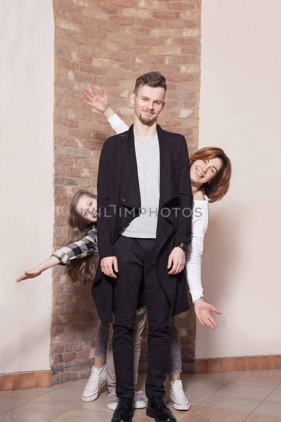 Portrait of happy family at home expressing joy and happiness