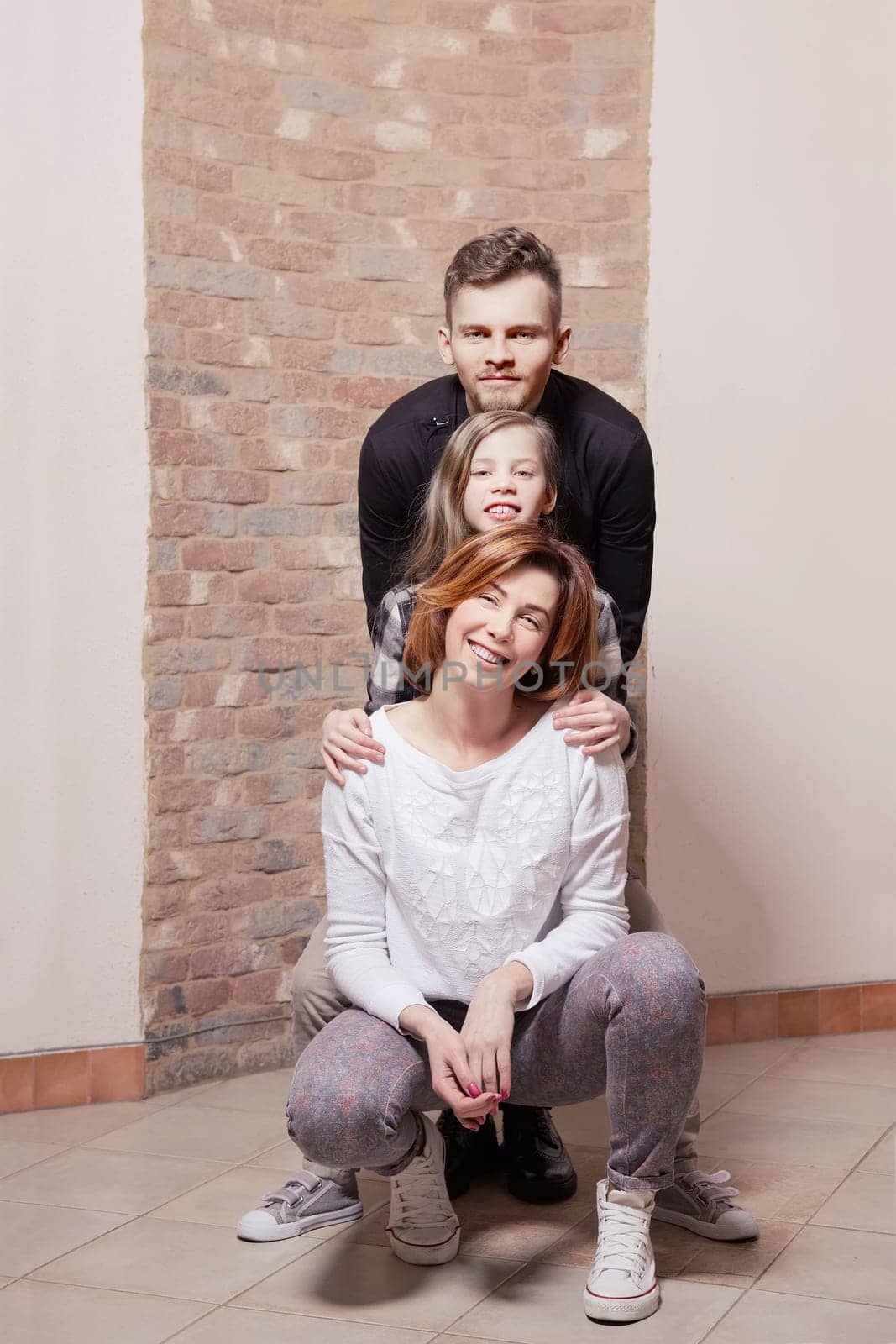 Portrait of happy family hugging each other