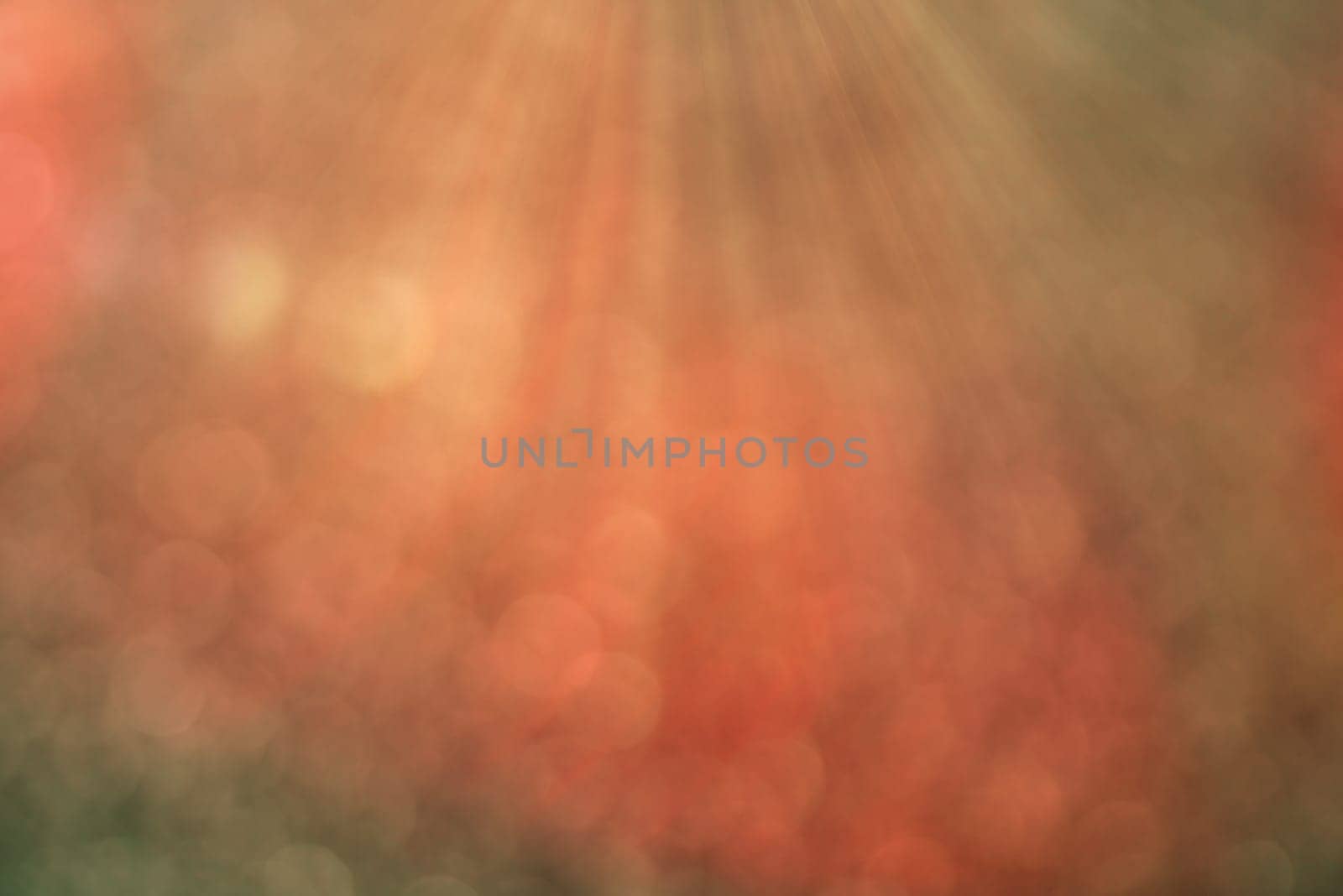 Pastel colored bokeh background with defocused round lights and sunbeams, flare overlay