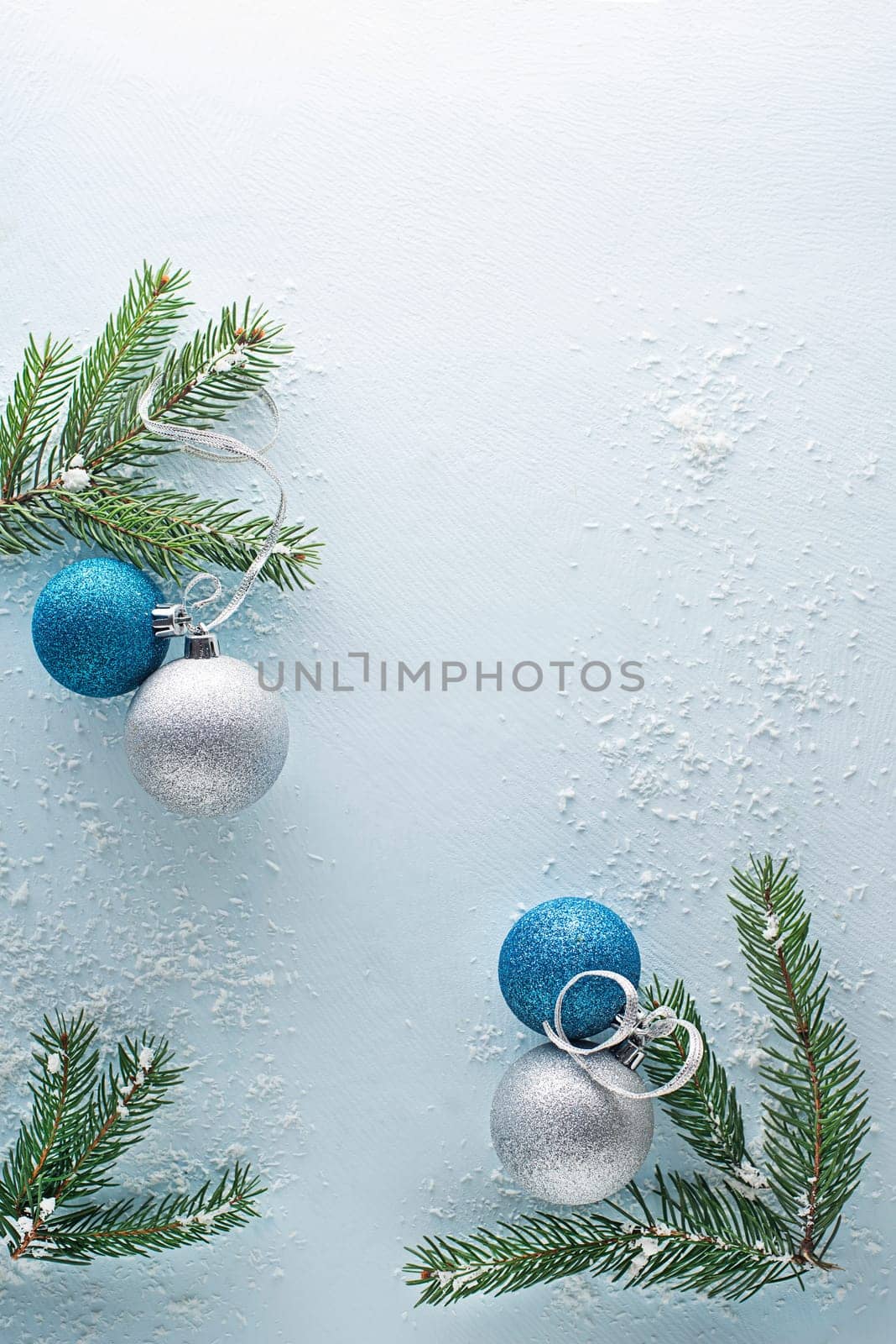 Christmas blue winter background with fir tree and decor. Top view with copy space