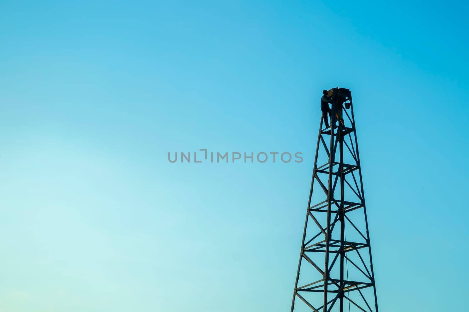 Pile rig construction worker building in evening