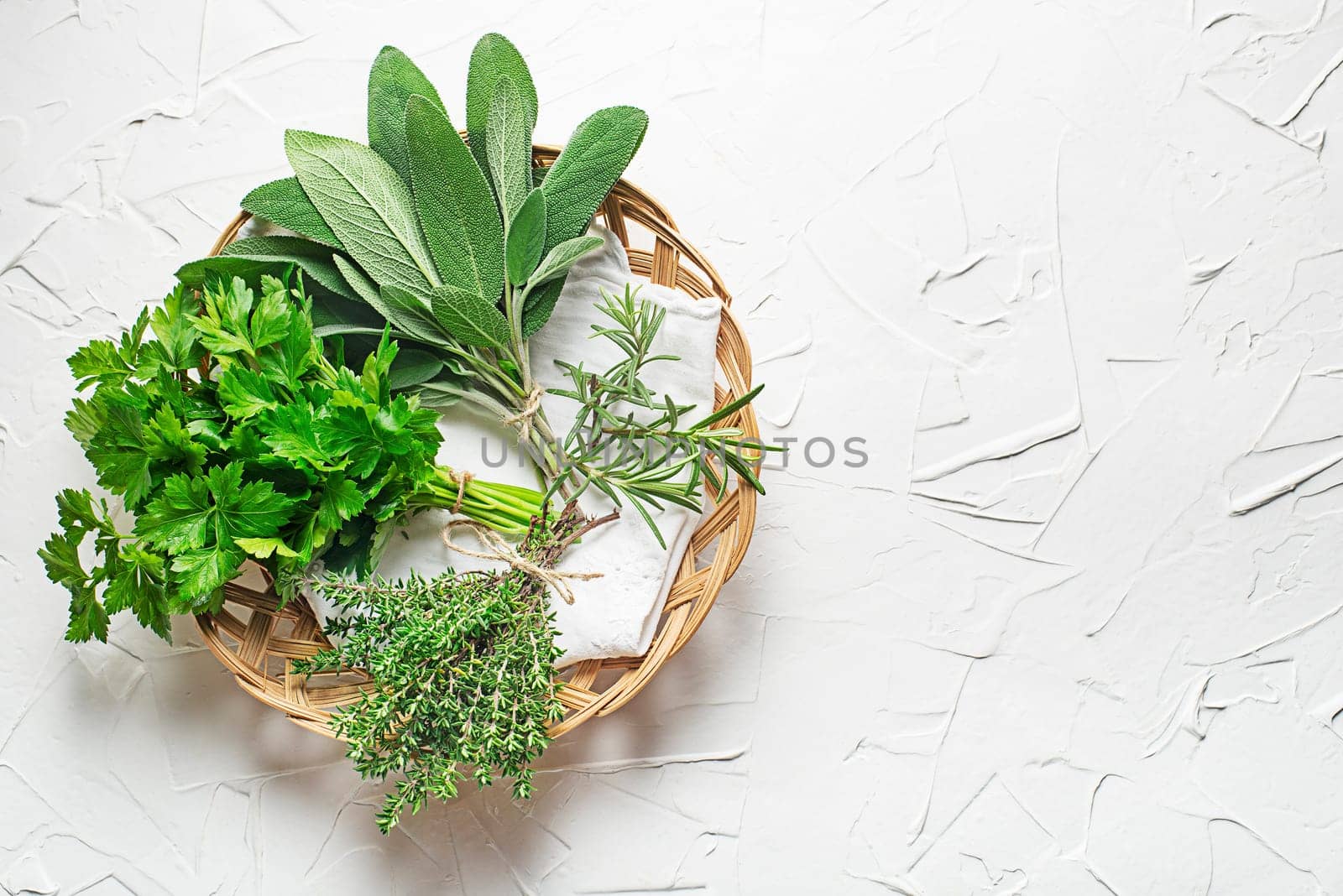Bouquets of fresh garden culinary plants of rosemary, thyme, parsley and sage. Fresh herbs for cooking healthy meal or natural health care