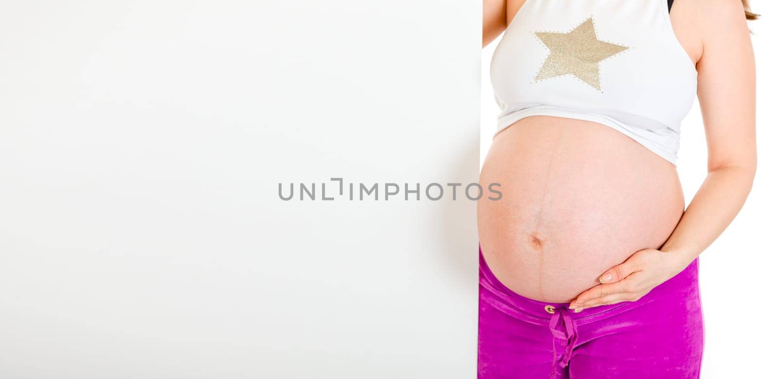 Pregnant woman holding blank billboard  isolated on white. Close-up..