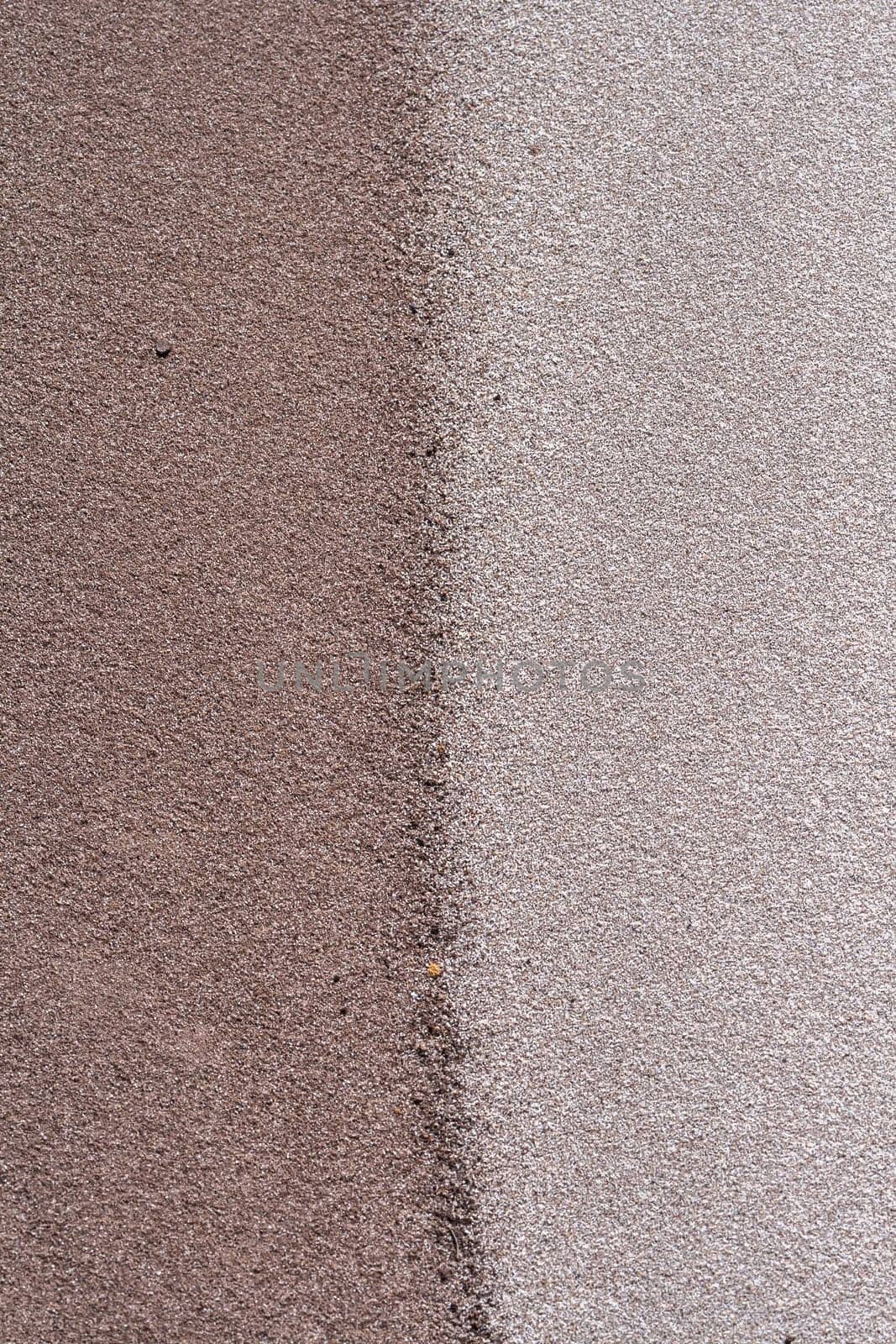 Sands mixing cream,grey,brown,colors joining line on beach embankment background.