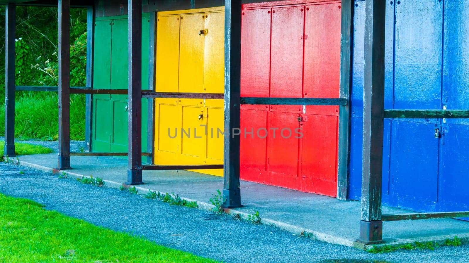 View of Bright colored beach huts on summer day