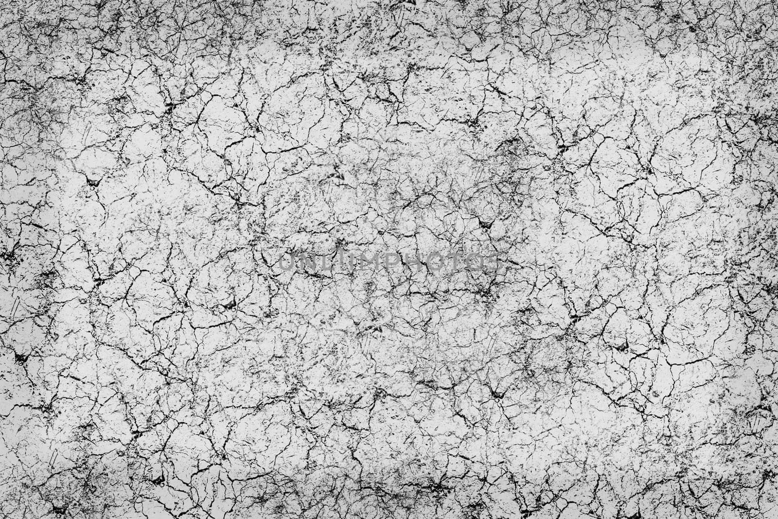 Marble background texture. Small highlighted veining on a light background. The edges are dark background and are lighter toward the center.