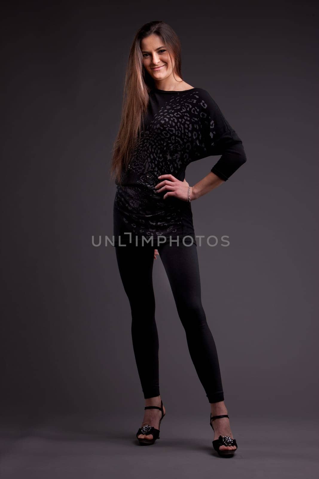 A long-haired beautiful self-confident woman posing
