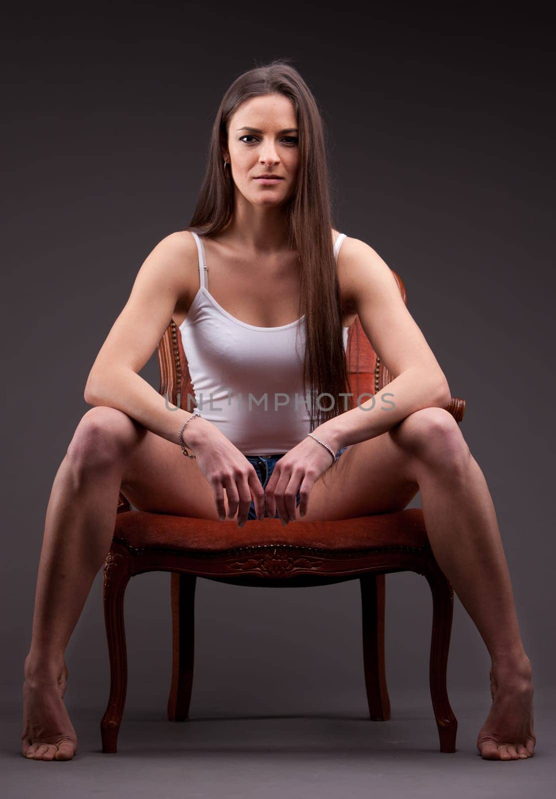 A long-haired beautiful self-confident woman posing