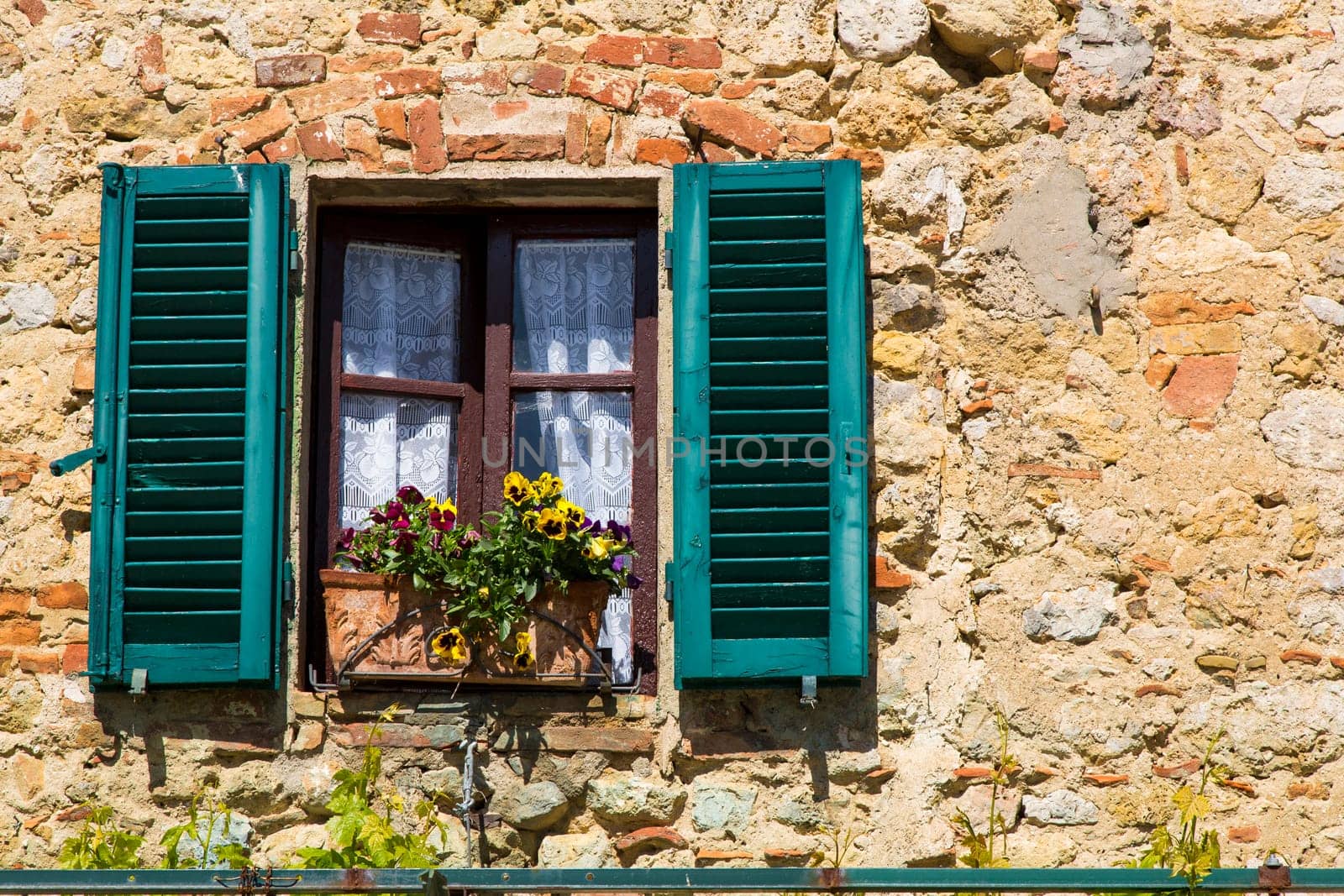 view from a window of an old house in a Tuscan village