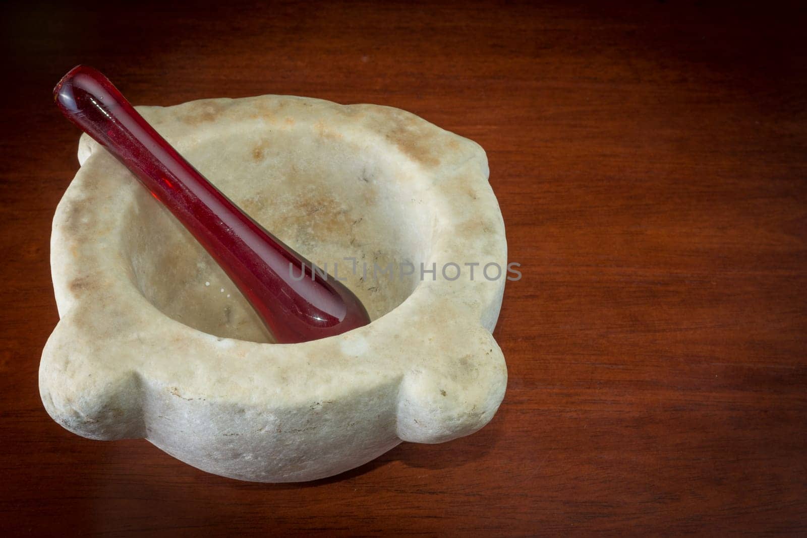 Ancient Marble mortar on a wood table