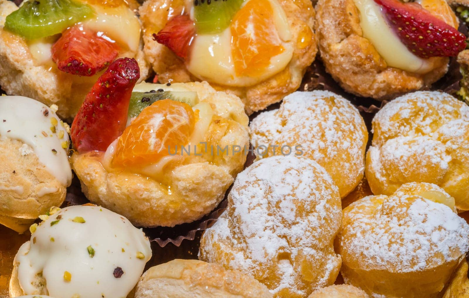 colorful pastries with fruits, cream and chocolate, the real Italian confectionery