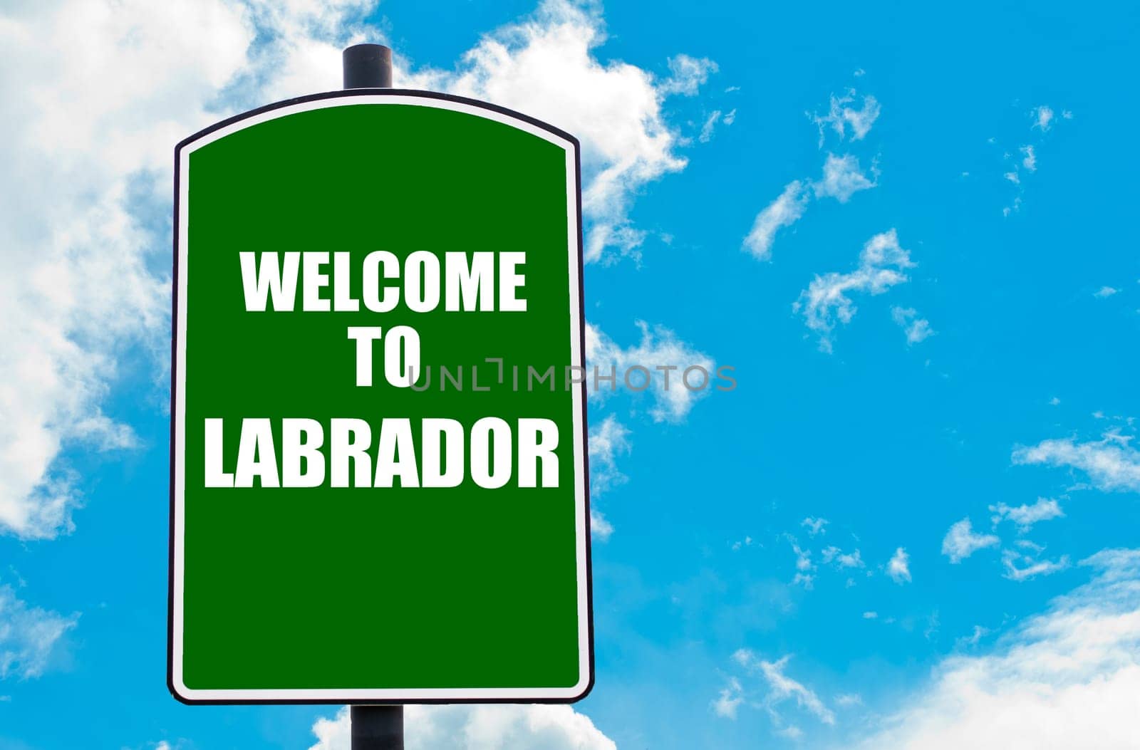 Green road sign with greeting message WELCOME TO ORLANDO isolated over clear blue sky background with available copy space. Travel destination concept  image