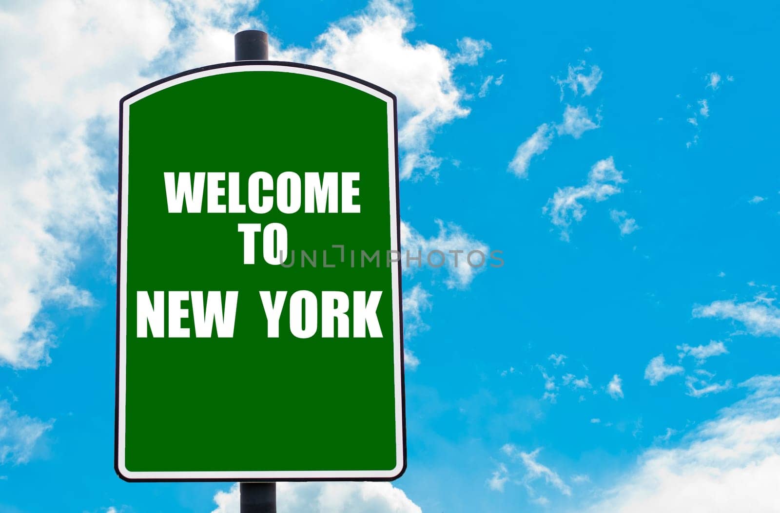 Green road sign with greeting message WELCOME TO ORLANDO isolated over clear blue sky background with available copy space. Travel destination concept  image