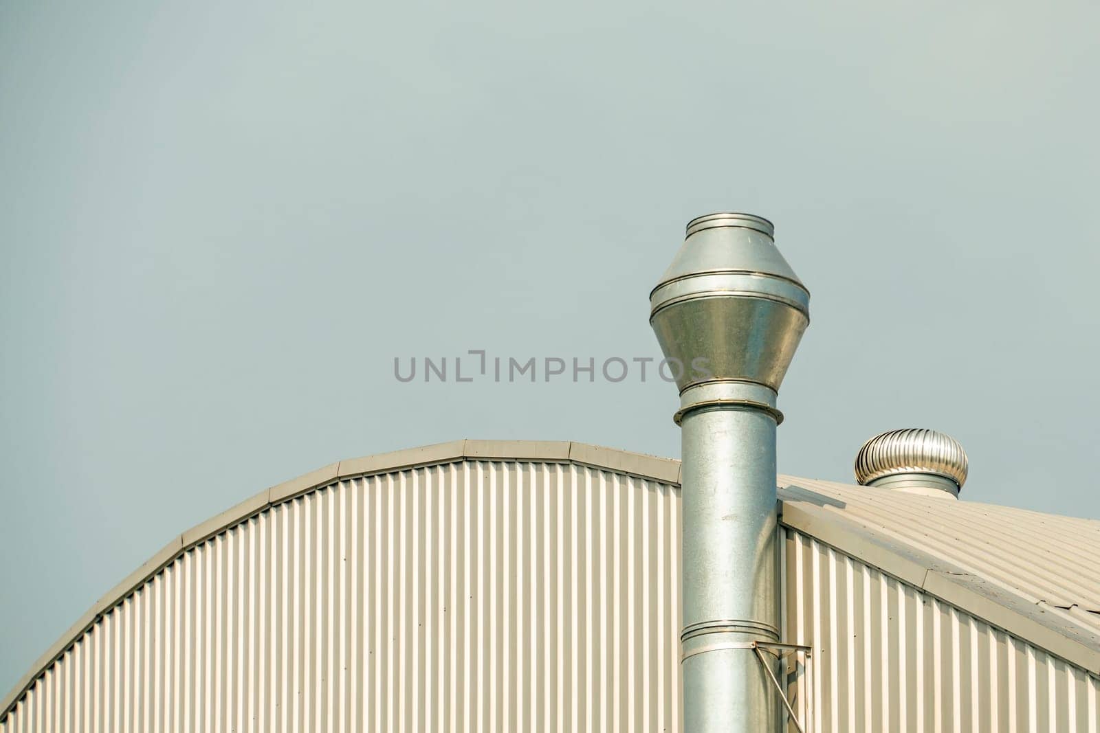 Several white ventilation vents are located near building.