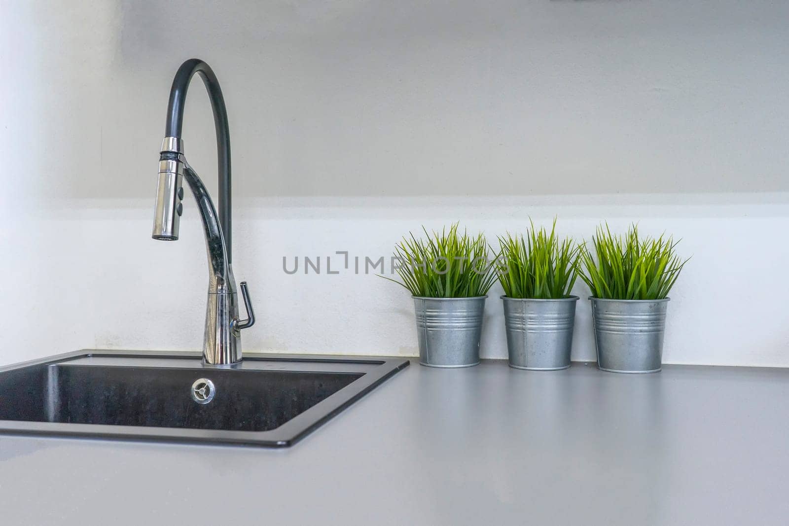 Kitchen sink and faucet in house interior