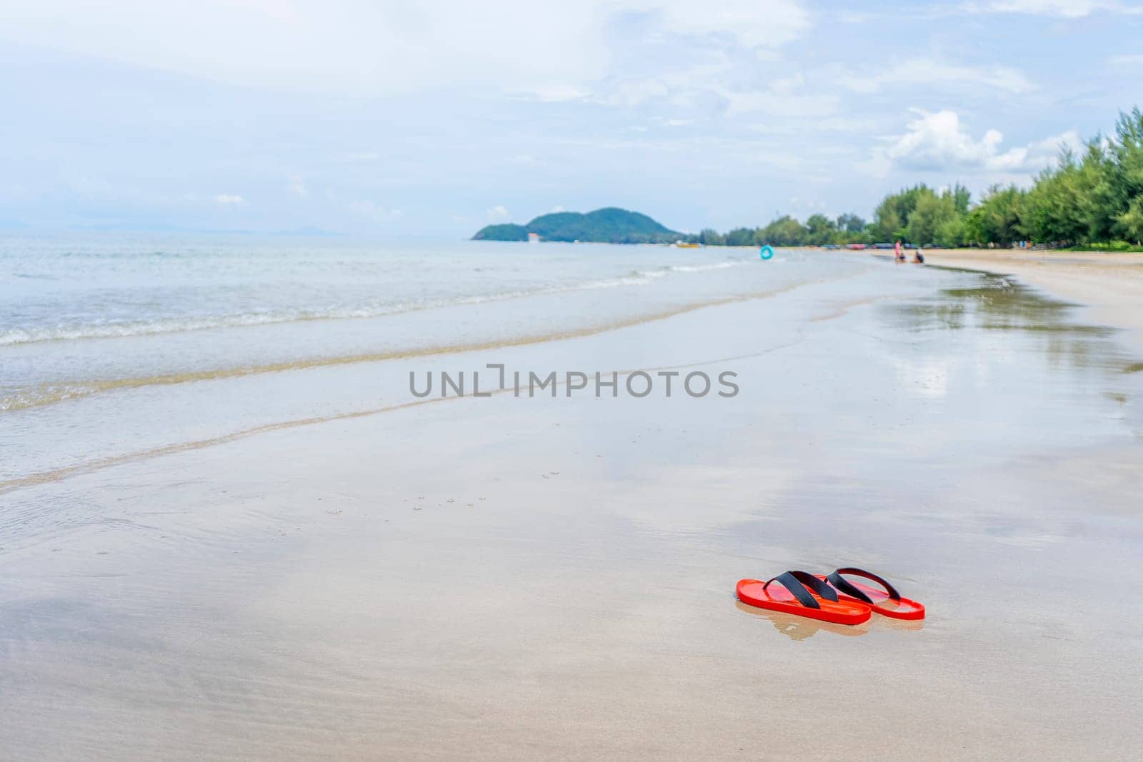 Red shoes on the beach on daylight