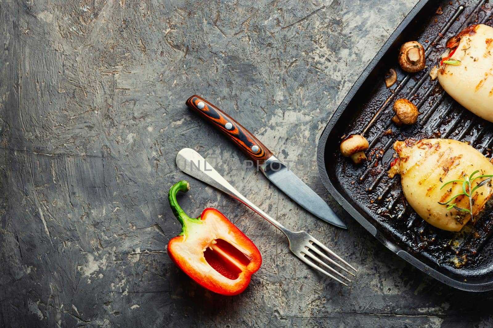 Grilled squids with vegetable stuffing. Stuffed calamari in grill pan