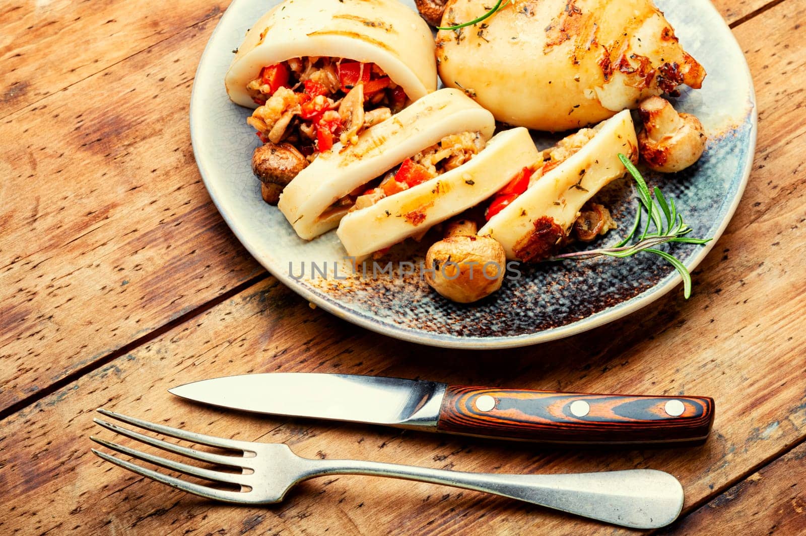 Grilled squids with vegetable stuffing. Stuffed calamari in grill pan