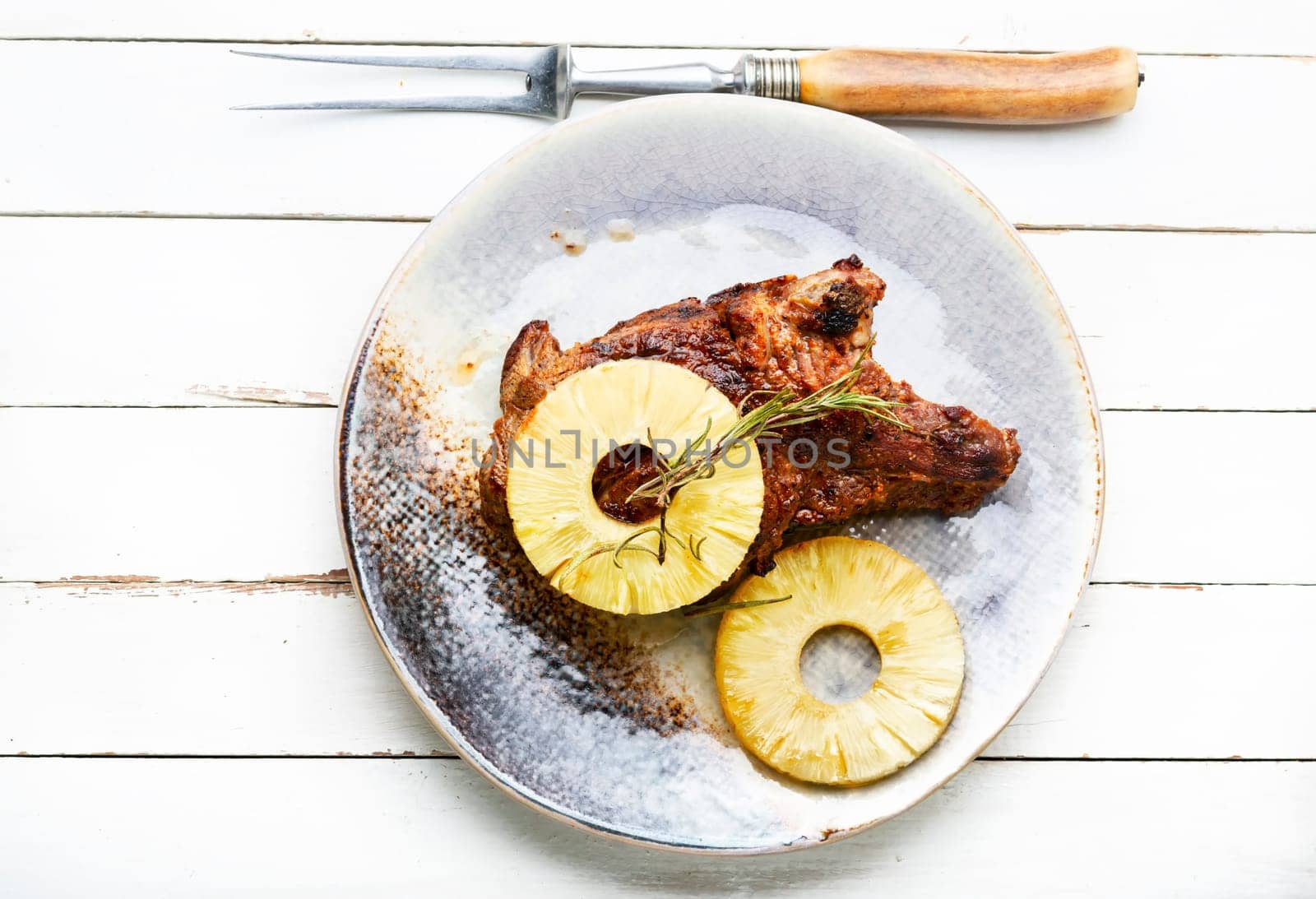 Delicious meat chop fried with pineapple rings