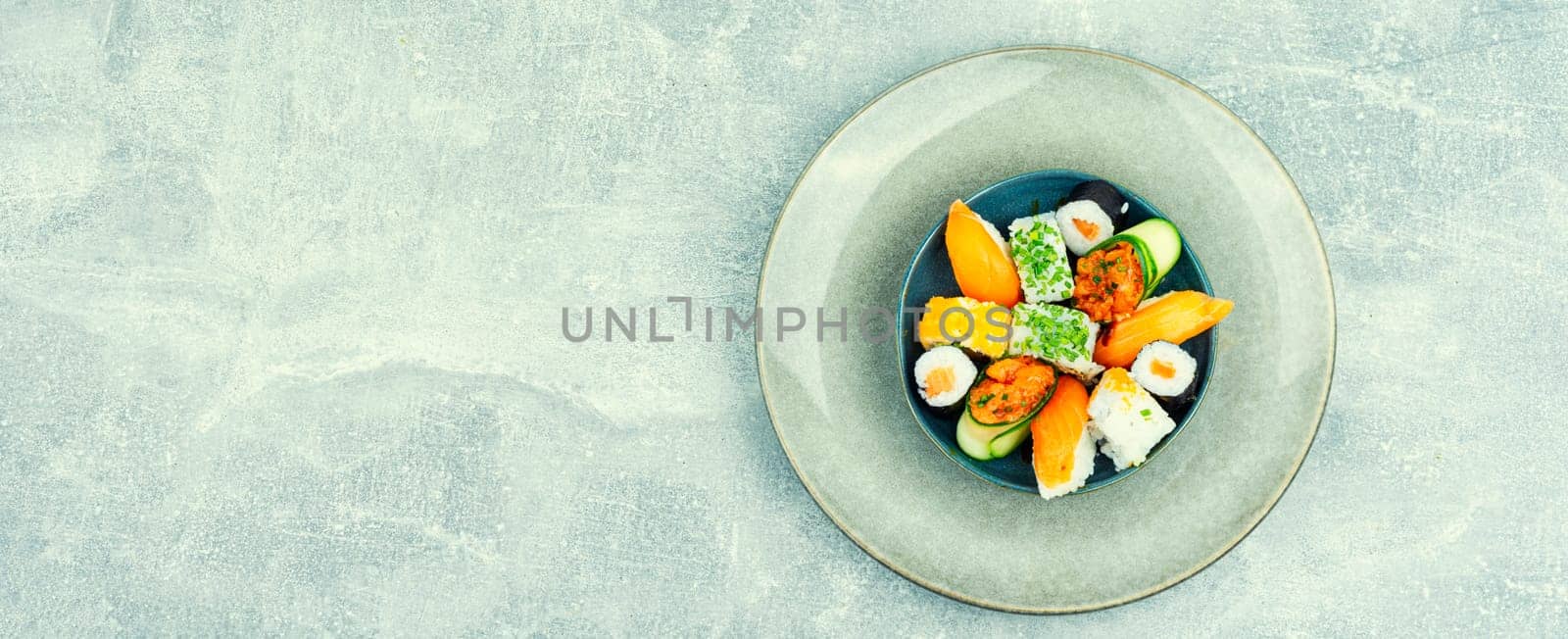 Appetizing sushi rolls on the plate. Sushi menu.
