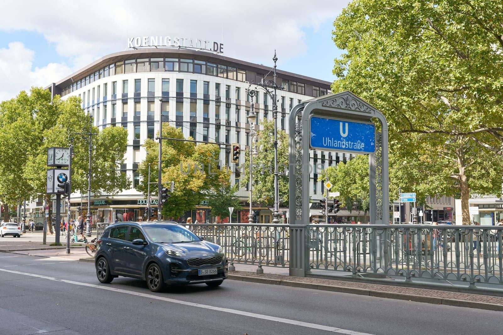Street scene with a car at Uhlandstrasse subway station on Kurfuerstendamm in Berlin