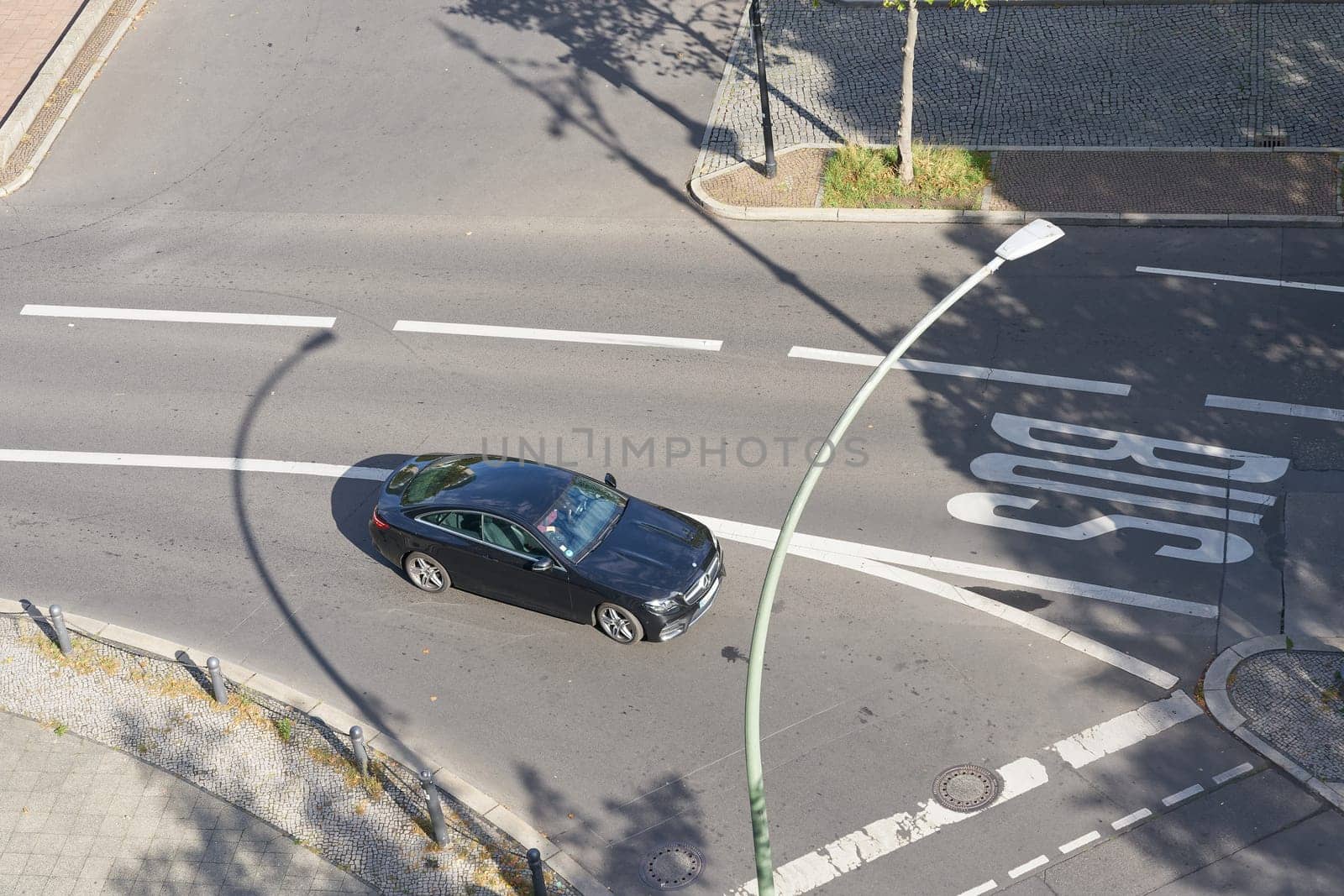 Street scene with cars at Kurfuerstendamm in Berlin from bird's eye view