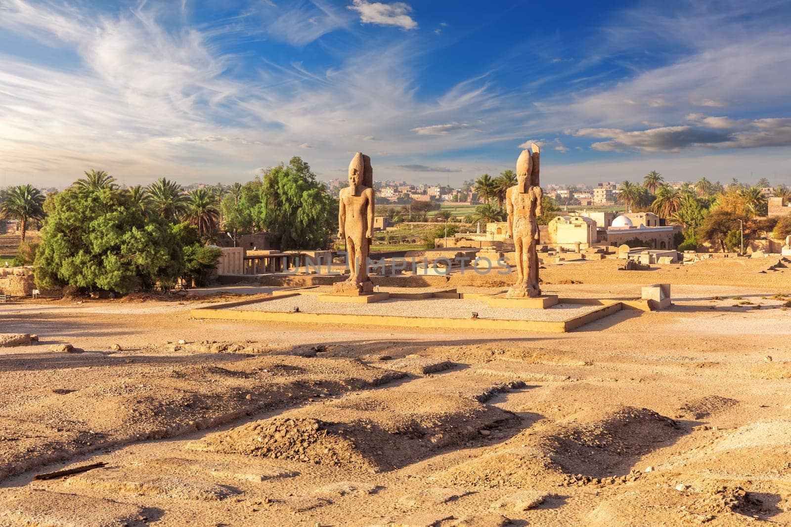 The great Colossal statues near Mortuary Temple of Thutmose III, Luxor, Egypt.