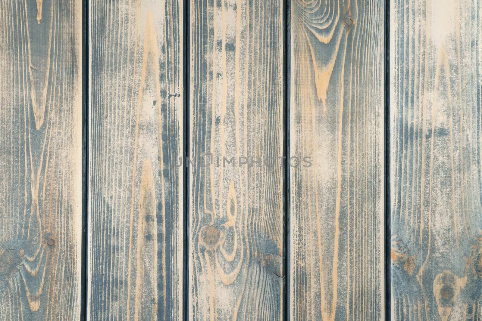 Gray striped planking. Wooden plank wall background for design and decoration. Empty space. Place for text. Dark hardwood material. Vertical floorboards. Wooden textured, natural tree.