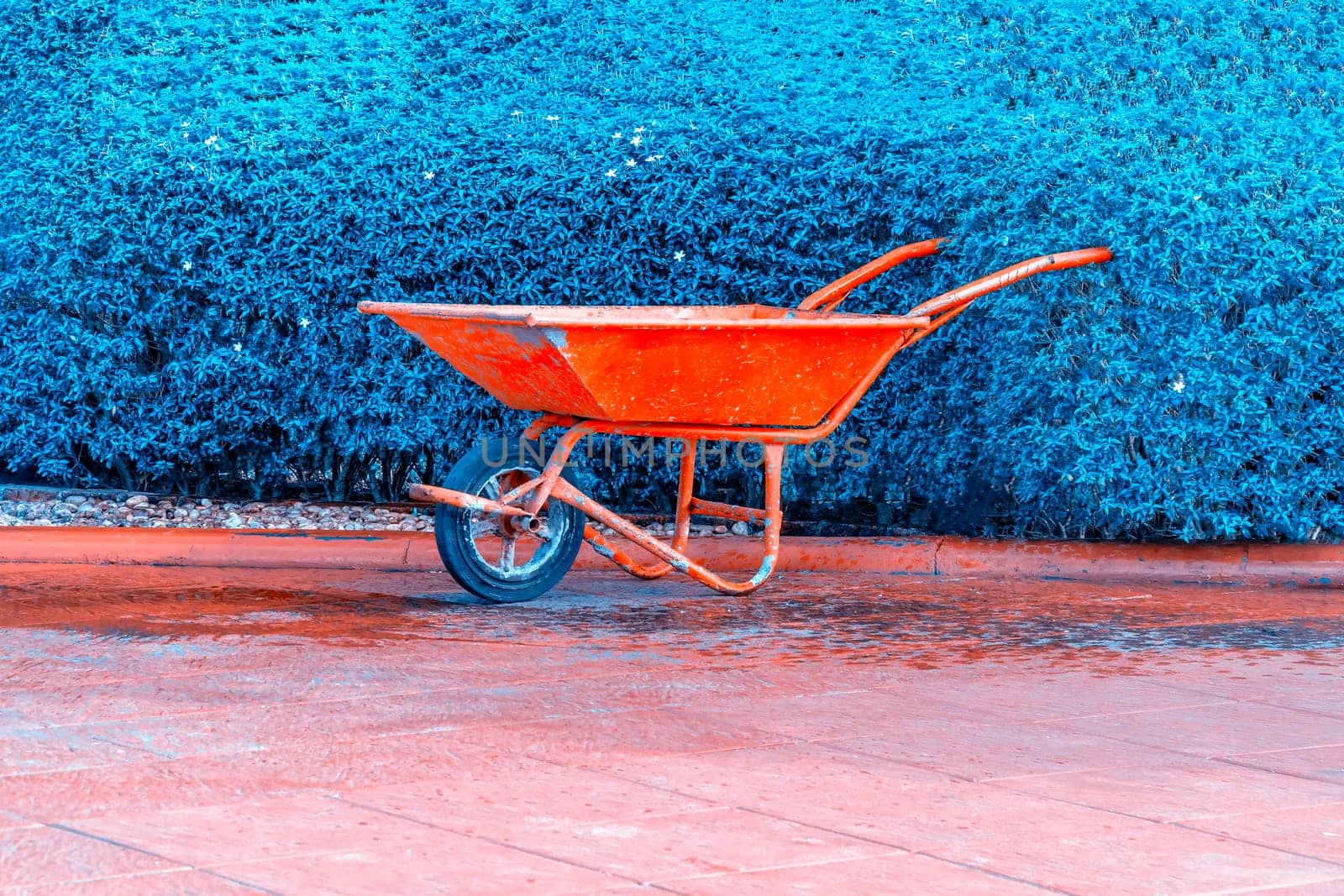 Cement cart red on blue green background