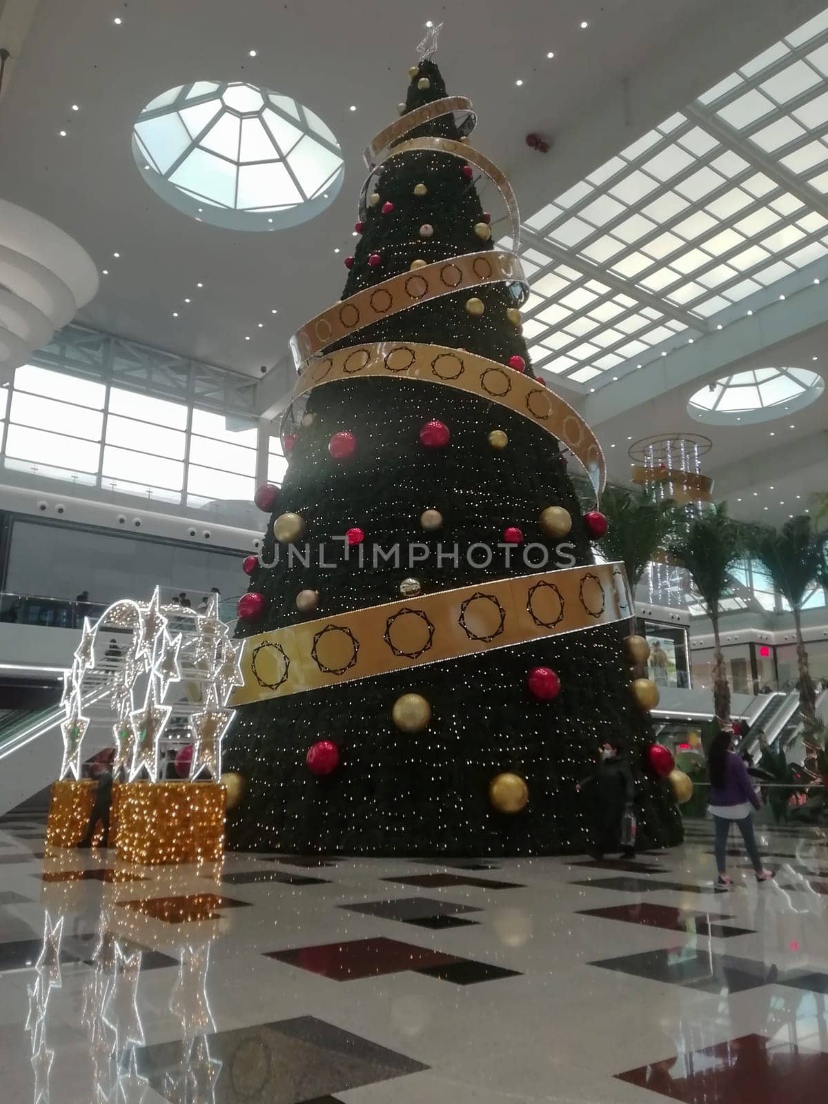 sierra nevada shopping centre, granada spain - december 22 2021: gigantic christmas tree at the entrance of the shopping centre