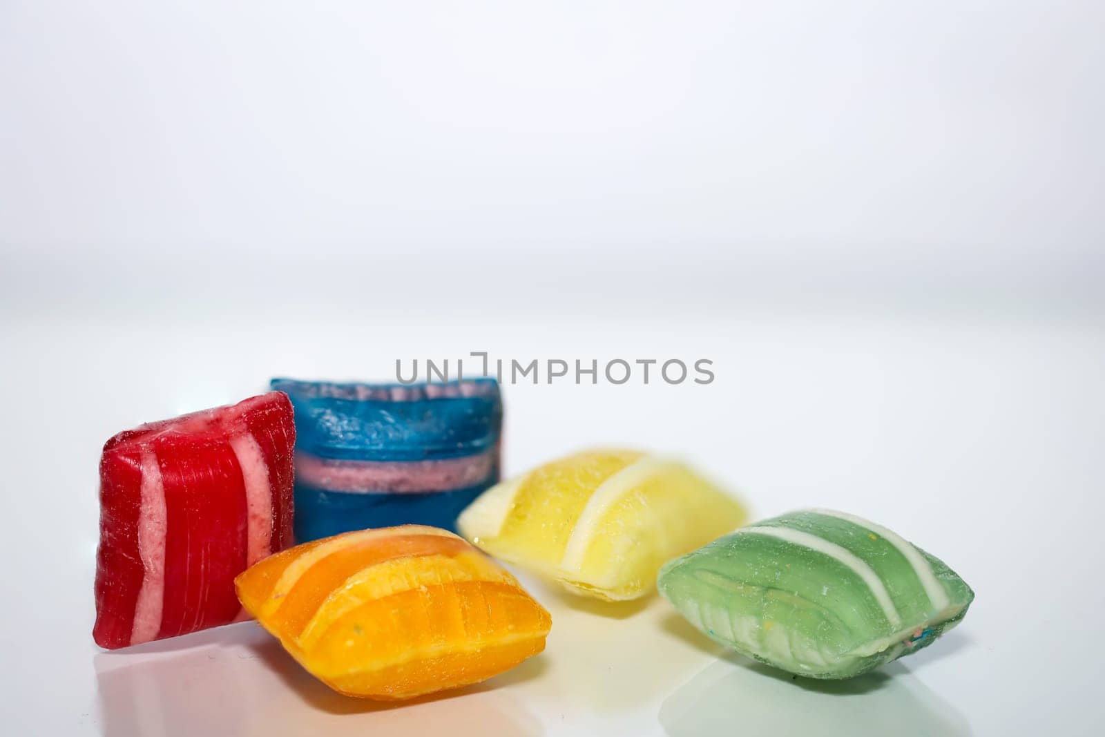 Candy in pillow shape on white background. Delicious sweet tooth.