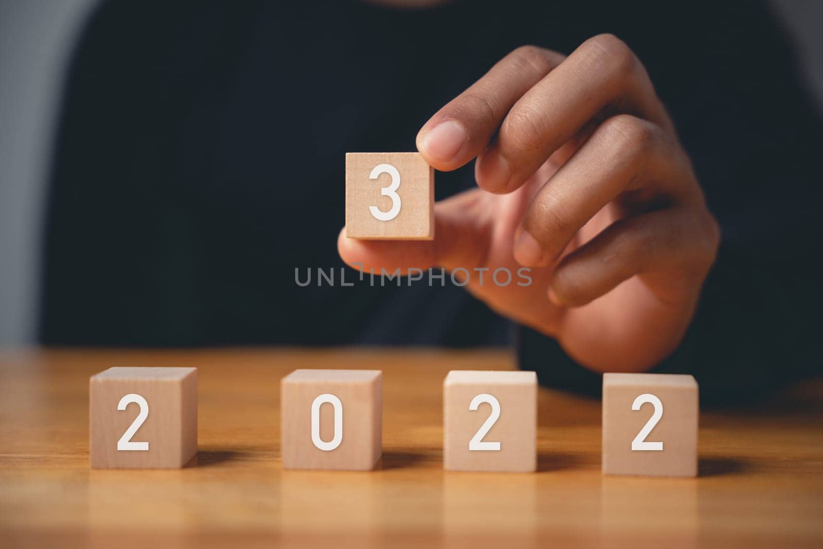 Happy New Year 2023. Happy businessman hand holding number 3 on wooden block to put replace or change previous year 2022, Business risk management, solution, Resolution, strategy, goal