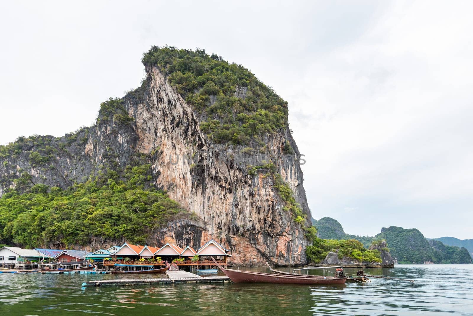 Landscape Koh Panyee or Punyi island home is floating over the sea during a boat tour at the Ao Phang Nga Bay National Park, Thailand