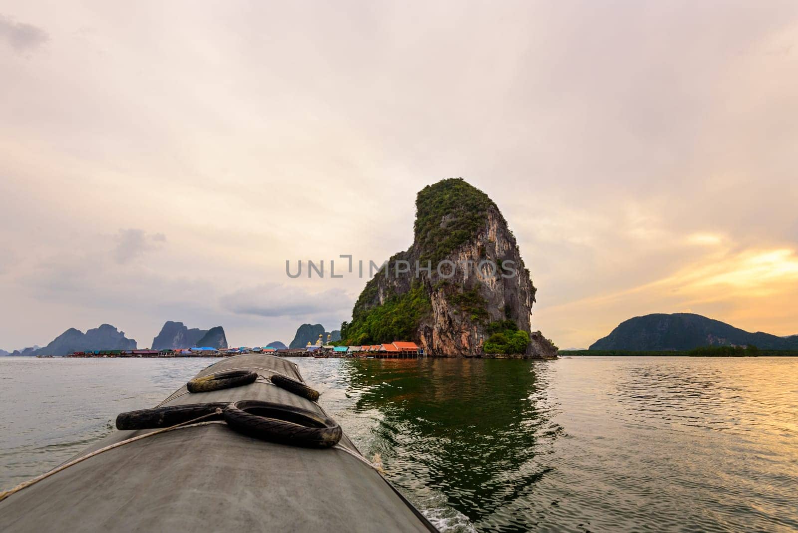 Beautiful landscapes of the sea in the sunset. During the trip from Koh Panyi or Koh Panyee island by boat in Ao Phang Nga Bay National Park, Thailand