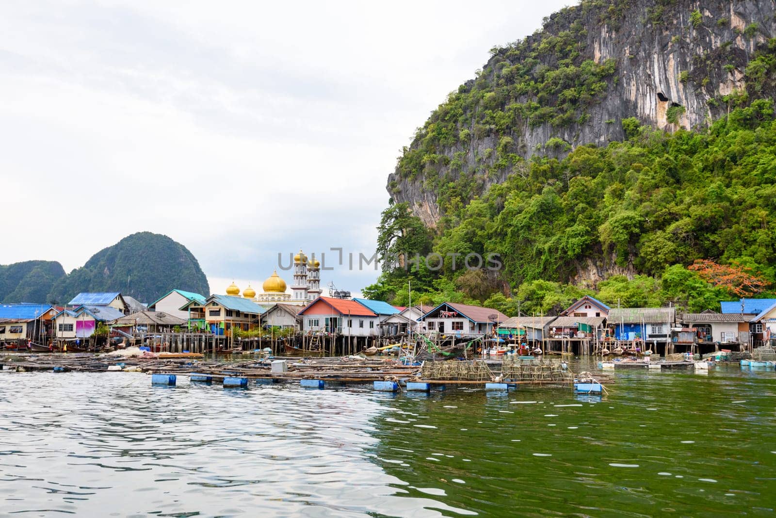 Landscape Koh Panyee or Punyi island home is floating over the sea during a boat tour at the Ao Phang Nga Bay National Park, Thailand
