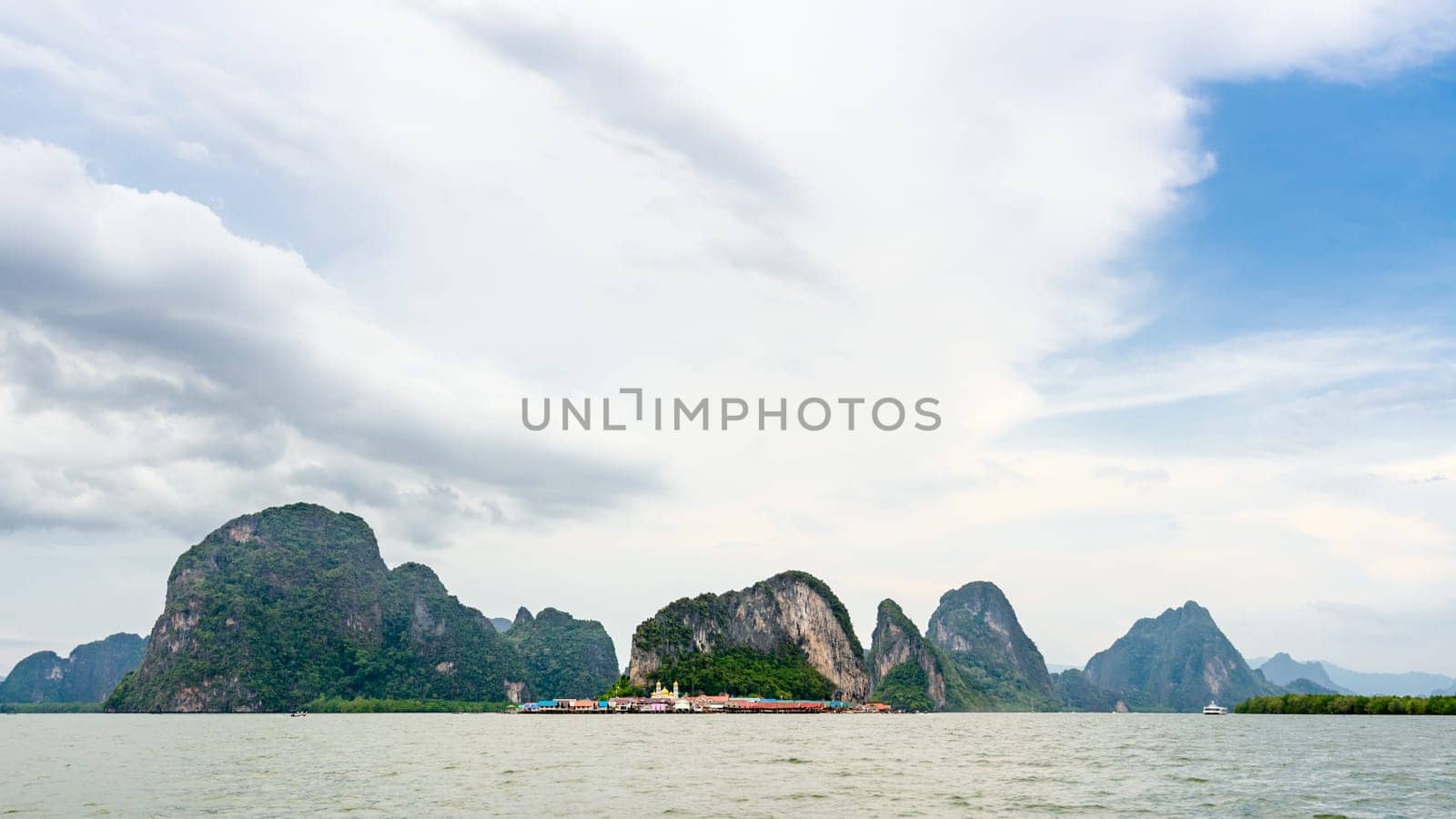 Beautiful landscape sea at Punyi Island or Koh Panyee is fisherman village cultural attractions in during a boat tour at the Ao Phang Nga Bay National Park, Thailand, 16