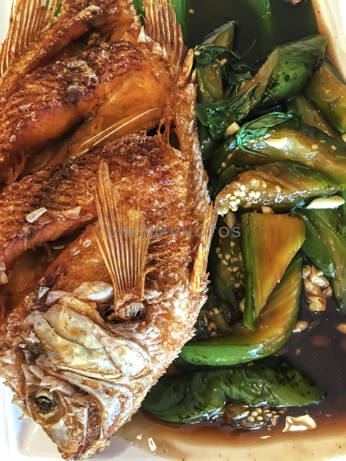 Fried fish with grilled eggplant