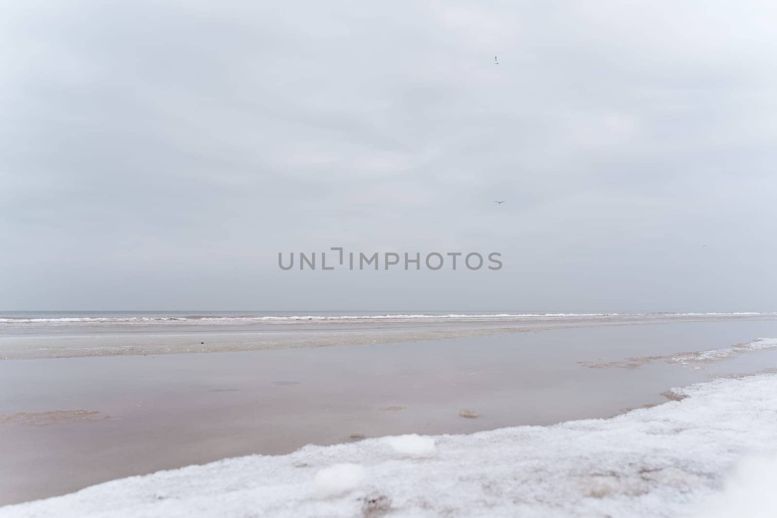 Baltic Sea coast on a winter cloudy day in Jurmala. Latvia
