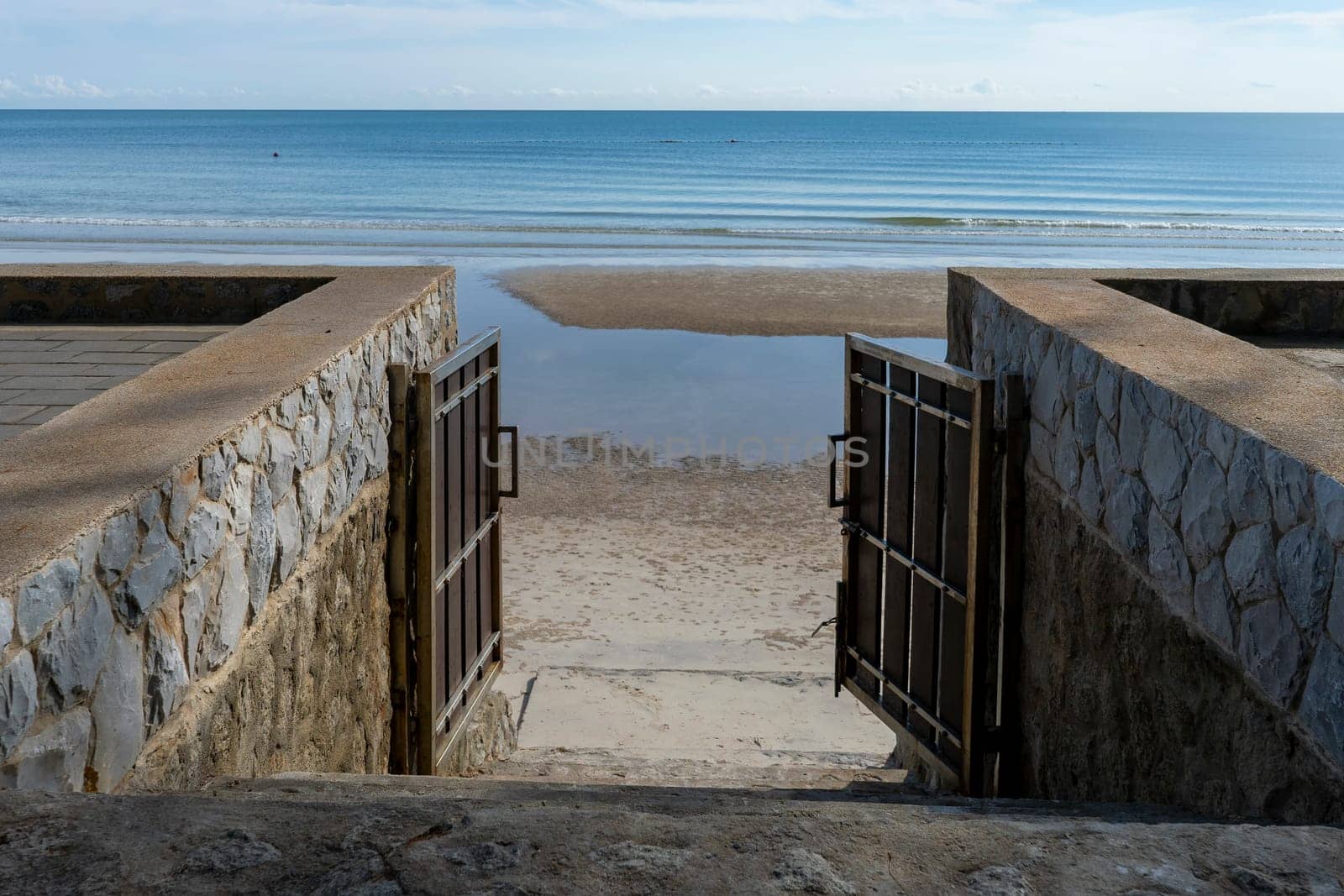 Sea behind the opened door house outside