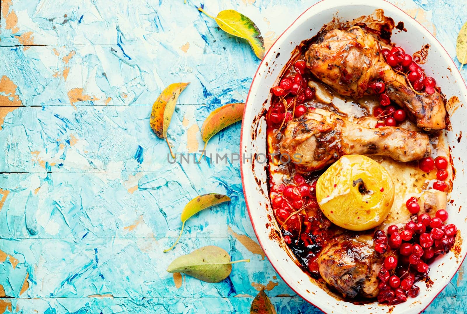 Chicken meat in apple and berry marinade. Roasted chicken thighs. Copy space, recipe place