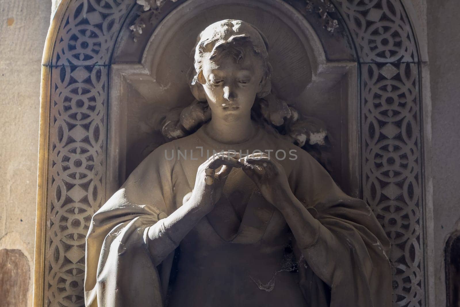 GENOA, ITALY - June 2020: antique statue, beginning 1800, made of marble, in a Christian Catholic cemetery - Italy