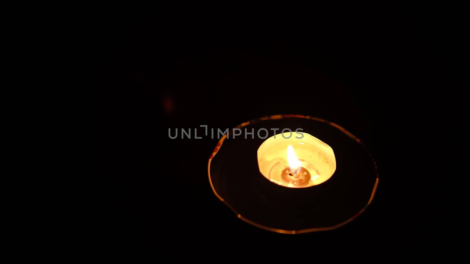 Candle burning, Detail of candle flames alight, lights from candles burning up close, flame burn candle lighting. Hand burn candle by the match vesta.