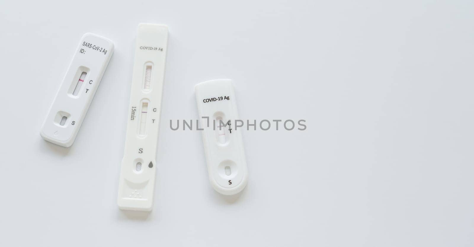 Coronavirus Covid-19 antigen test with various result on white background.