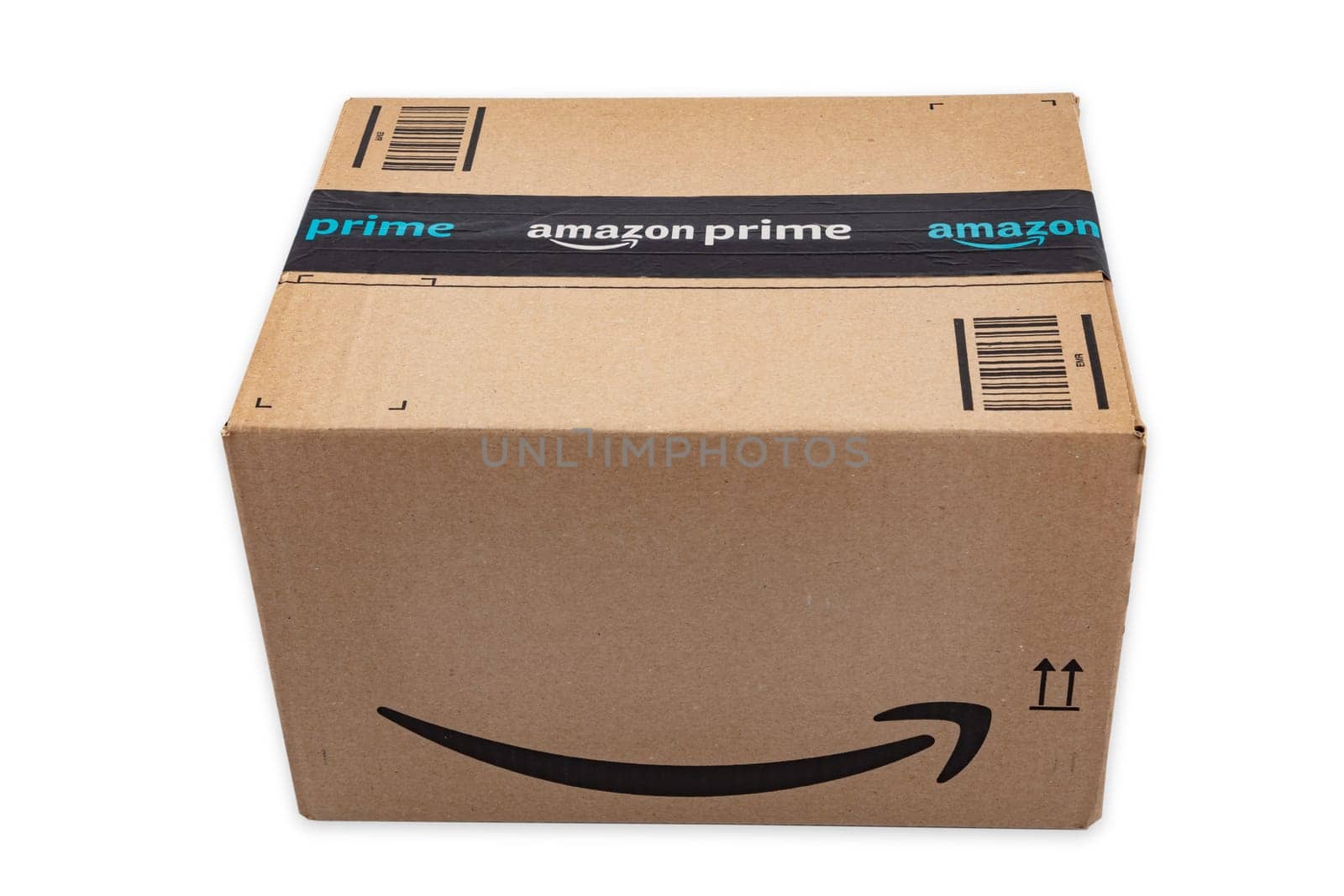 WETZLAR, GERMANY 2022-04-25: Amazon Prime parcel over white background. Prime is a service offered by online retailer Amazon for faster delivery of orders.
